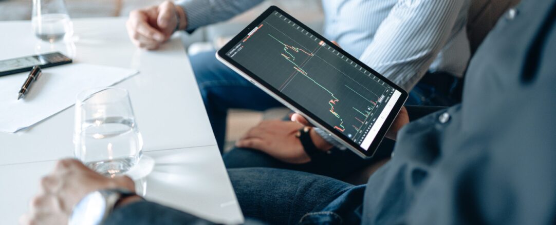 pexels-alphatradezone-5833846 people looking at data on a tablet