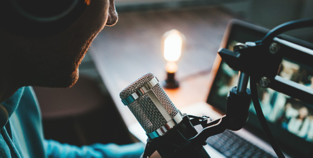 live podcast using professional microphone at small broadcast studio