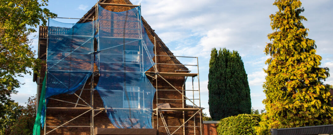 renovation work with scaffolding on a town house, outdoors